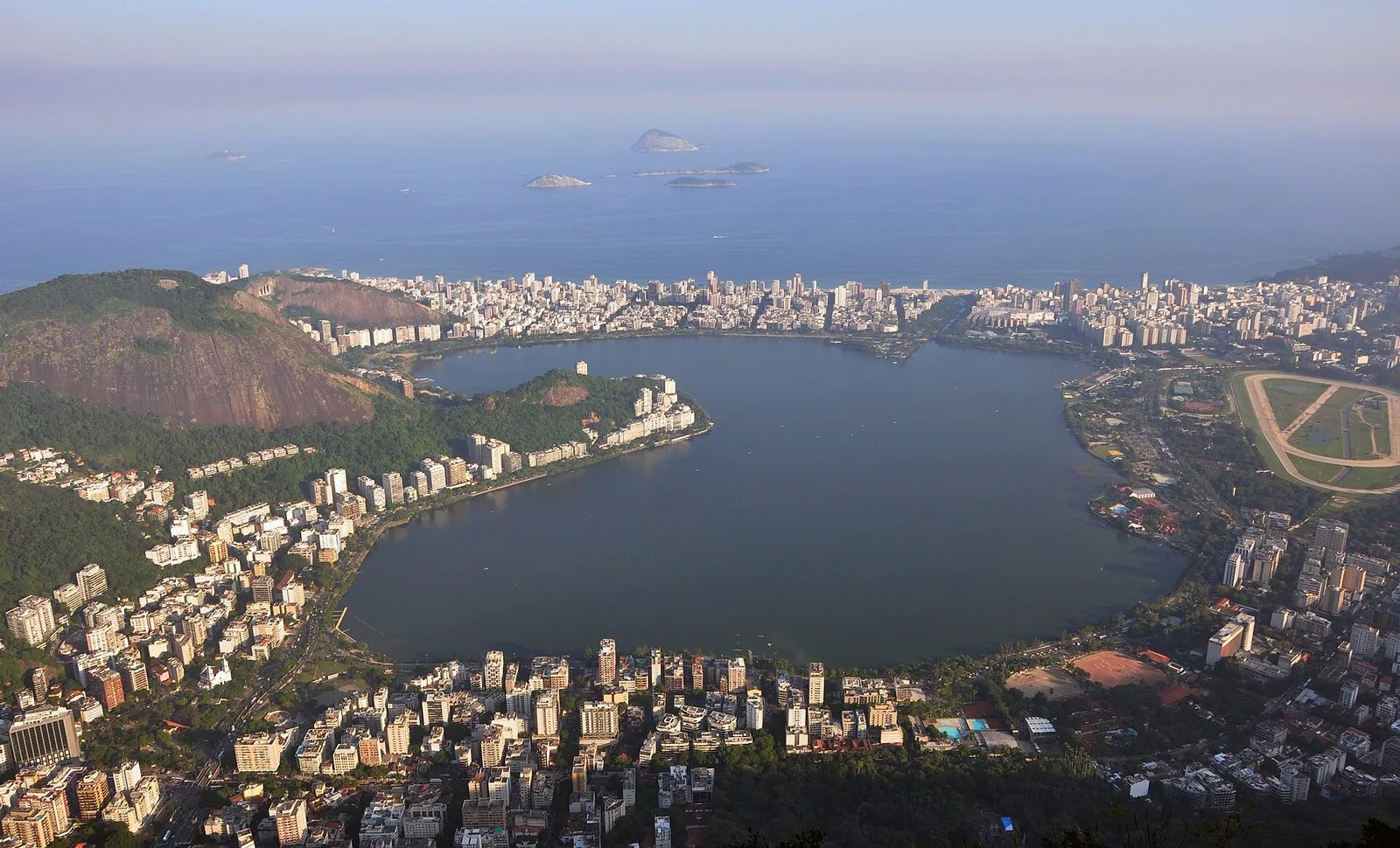 Lagoa Rodrigo de Freitas at evening with Christ the Redeemer visible on the mountain beyond