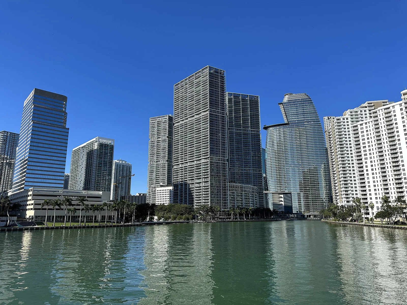 Downtown Miami and Brickell skyline at sunset, seen across Biscayne Bay